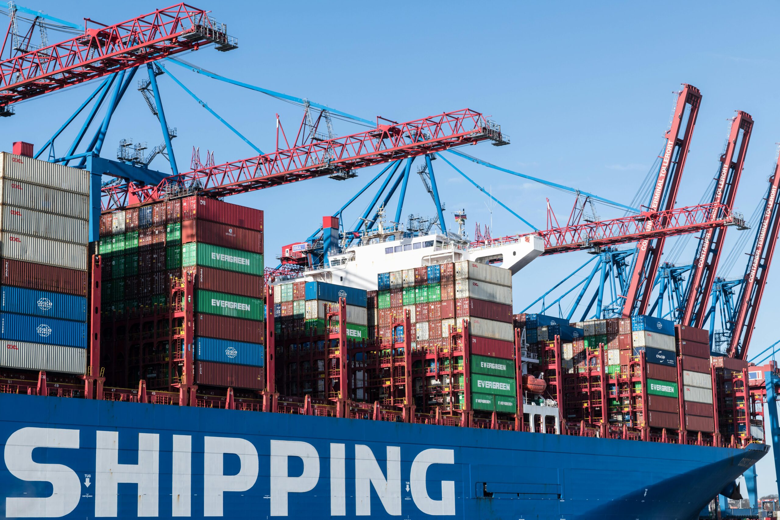 A large cargo ship transporting goods across international waters, symbolizing global trade, secured transactions, and financial instruments like Bank Guarantees (BG) issued by Genuine BG/Sblc Providers like General Credit Finance and Development Limited